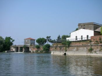 Small town of Porto, detail of the walls and of the Mezzo Lake